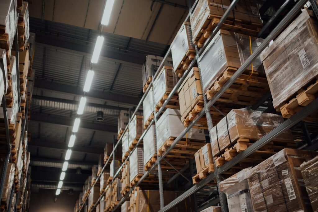 Cardboard inventory boxes on warehouse shelves — illustrative category photograph